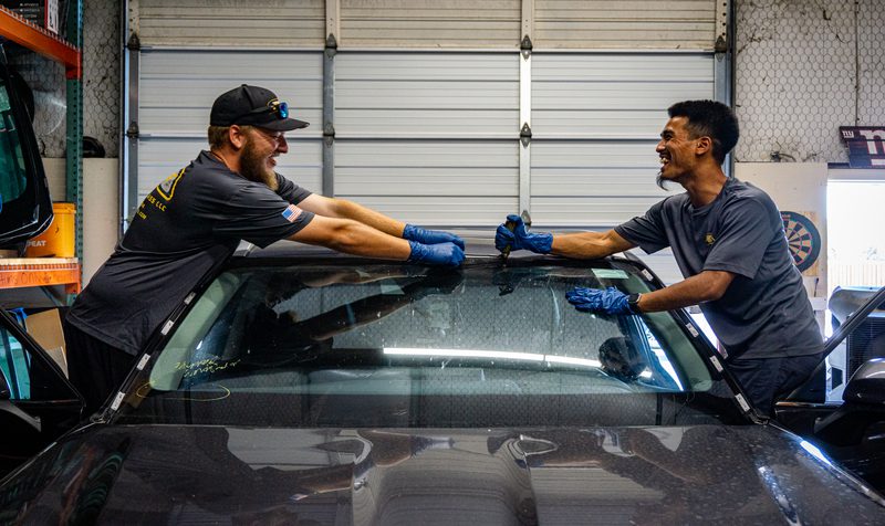 Shop (1) (1) a person is lifting the cars glass